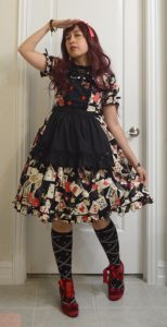 photo of red and black Alice themed coord and a sad and tired expression