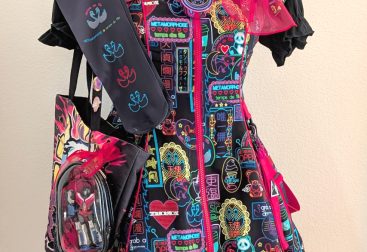 Meta's Cyber Neon Girl black jumperskirt coord on a mannequin, complete with tote bag and handmade jewelry