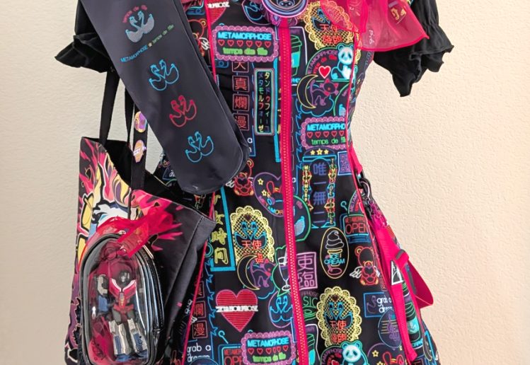 Meta's Cyber Neon Girl black jumperskirt coord on a mannequin, complete with tote bag and handmade jewelry