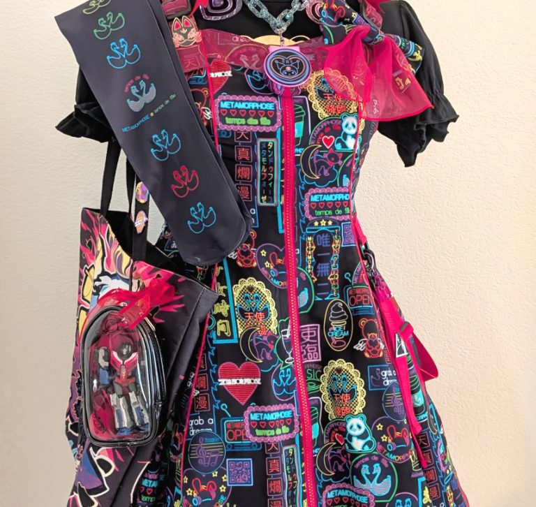 Meta's Cyber Neon Girl black jumperskirt coord on a mannequin, complete with tote bag and handmade jewelry