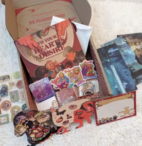 Dungeon Meshi fanzine cookbook with the full bundle of merch!