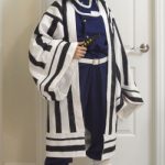 photo of myself in my bathroom wearing Obanai Iguro cosplay and a n95 mask