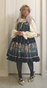photo of Metamorphose Temps de Filles coord of Rose Palace jumperskirt in teal colorway with cream and gold accents