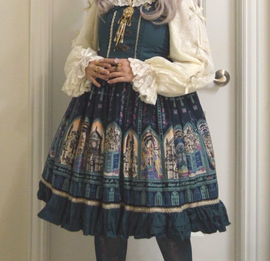 photo of Metamorphose Temps de Filles coord of Rose Palace jumperskirt in teal colorway with cream and gold accents
