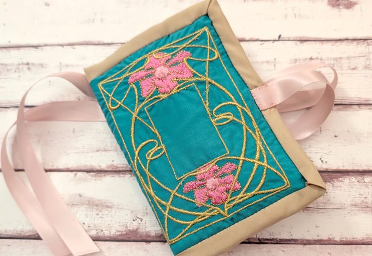 the front of the embroidered husswif, with design patterened by sewstine