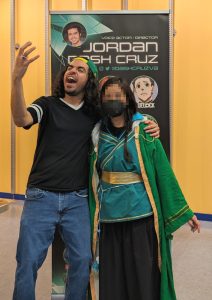 photo of me in Qi Rong cosplay with the English voice actor for Qi Rong, Jordan Dash Cruz
