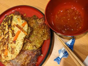 photograph of split pea korean style pancakes with vegetables and sweet chili sauce