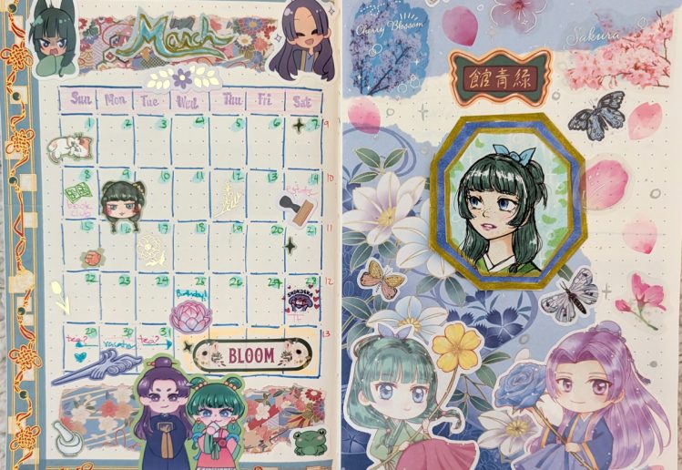 photograph of March 2026 monthly bullet journal spread with calendar on left side and sticker collage and fanart of Maomao from Apothecary Diaries on the right side. The color scheme is blue and pink