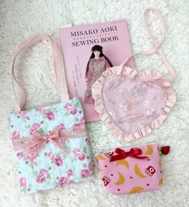 photograph of 3 handmade print fabric bags with Misako Aoki sewing book volume 2 in the background