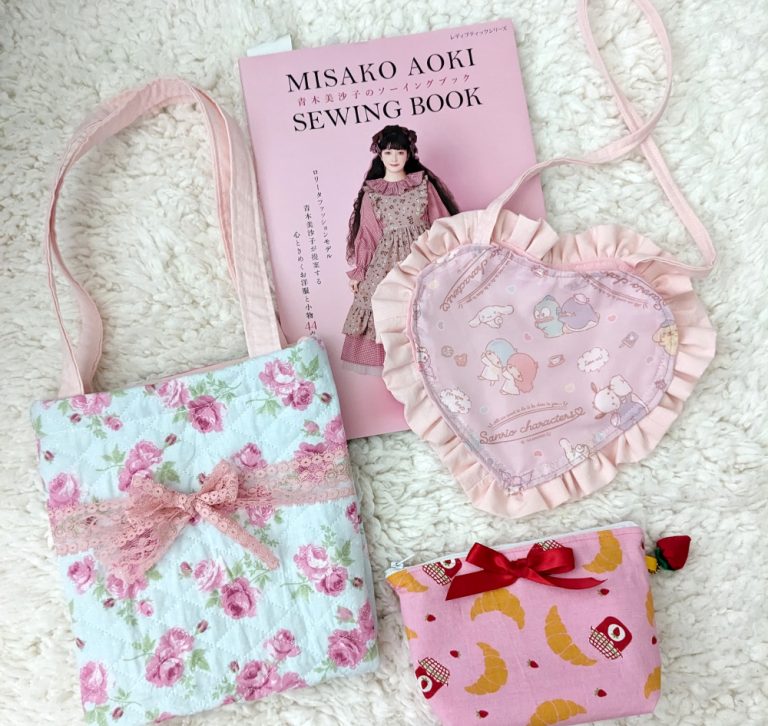 photograph of 3 handmade print fabric bags with Misako Aoki sewing book volume 2 in the background