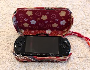 photograph of a PSP console in the new custom case