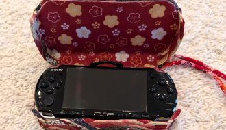 photograph of a PSP console in the new custom case