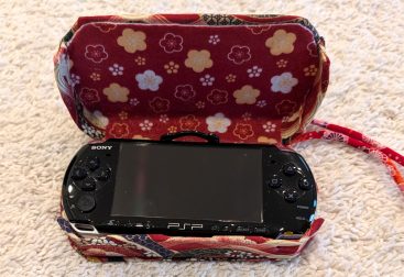 photograph of a PSP console in the new custom case