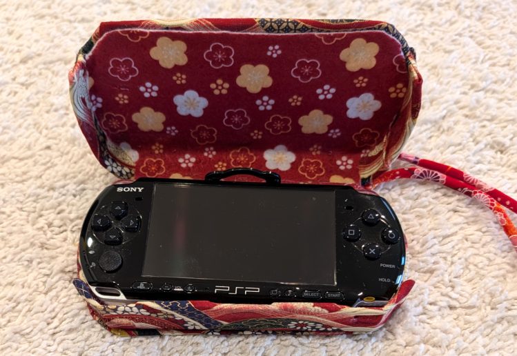 photograph of a PSP console in the new custom case