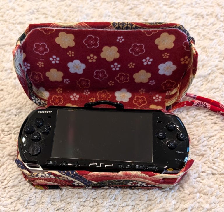 photograph of a PSP console in the new custom case