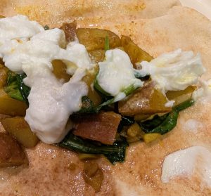 spiced potatoes and wilted spinach on garlic naan with toum