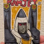 trading card portrait of Ramjet from Transformers, based on his studio series figure that I got, I guess it's G1, idk. He's a little uggo, but that's canon. Ink and alcohol and acrylic markers