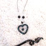 black glittery resin heart shape pendant necklace and a hairstick of the same material