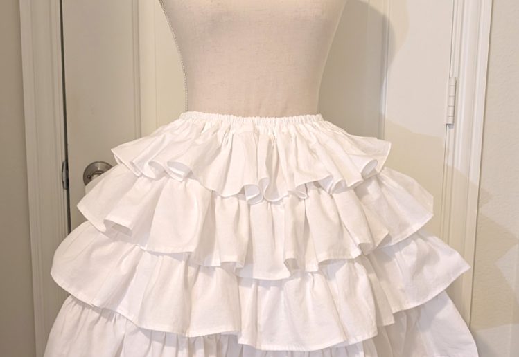 white cotton muslin ruffly underskirt, with the uneven ruffles fixed