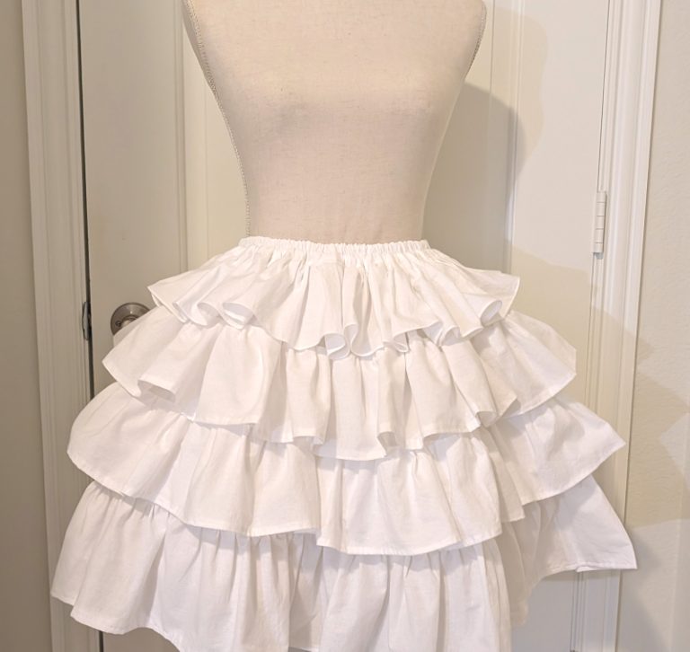 white cotton muslin ruffly underskirt, with the uneven ruffles fixed