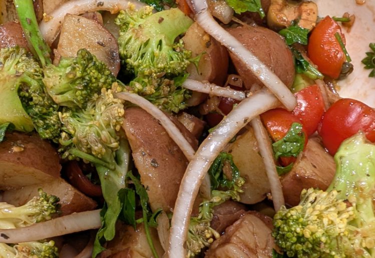 Italian style potato salad with various vegetables and dressing